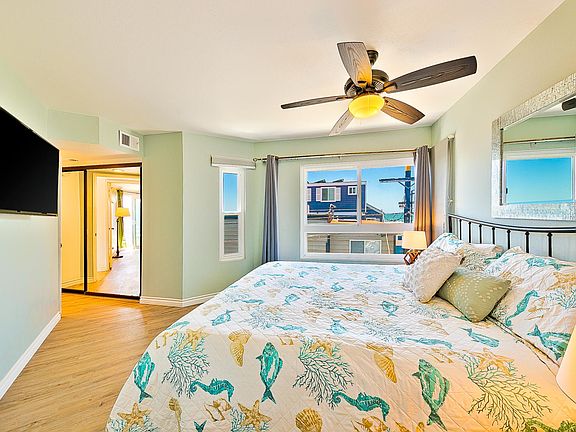 Bedroom 1 - California King with patio and TV (shared full bathroom). 3rd level