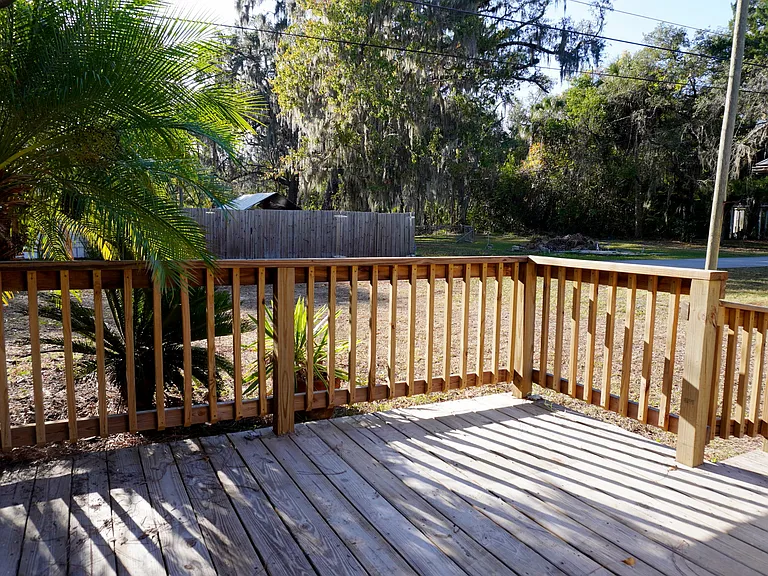 Off the den is a ground level deck for enjoying evening sunset light. Easy in and out of the house with only one step.
