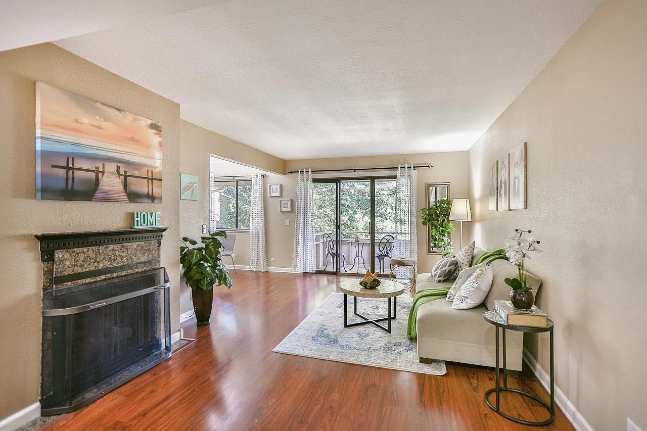 Living room with gas fireplace and patio