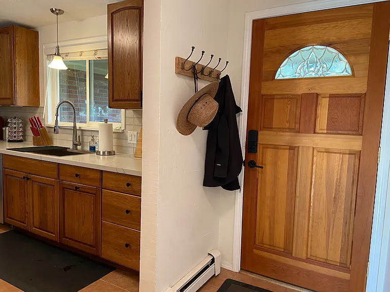 Main level entrance; kitchen on photo right; coat closet left