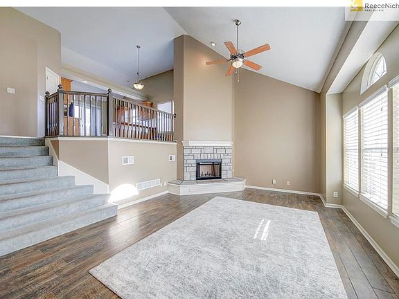 Soaring Ceiling with ceiling fan , lots of natural light, New flooring and paint