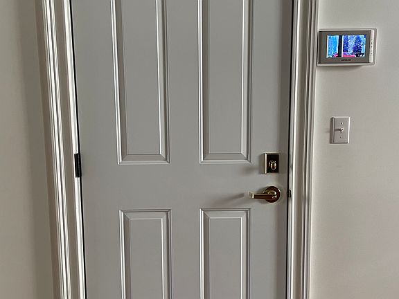 Inside apartment door showing intercom with front entrance door