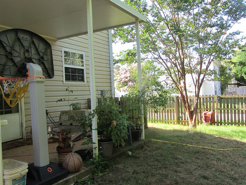 patio in fenced backyard