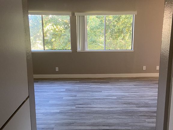 View front room from hallway. Extra closet space in hallway linen closet.
