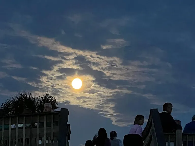 This picture of a morning moon was taken at Easter sunrise service on the beach as the sun was just about to poke above the horizon.