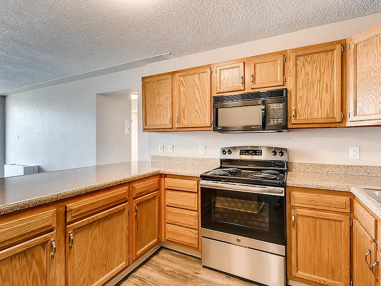 Our Apartment Kitchen with Stone Countertop at Scandia Apartments in Englewood, Colorado