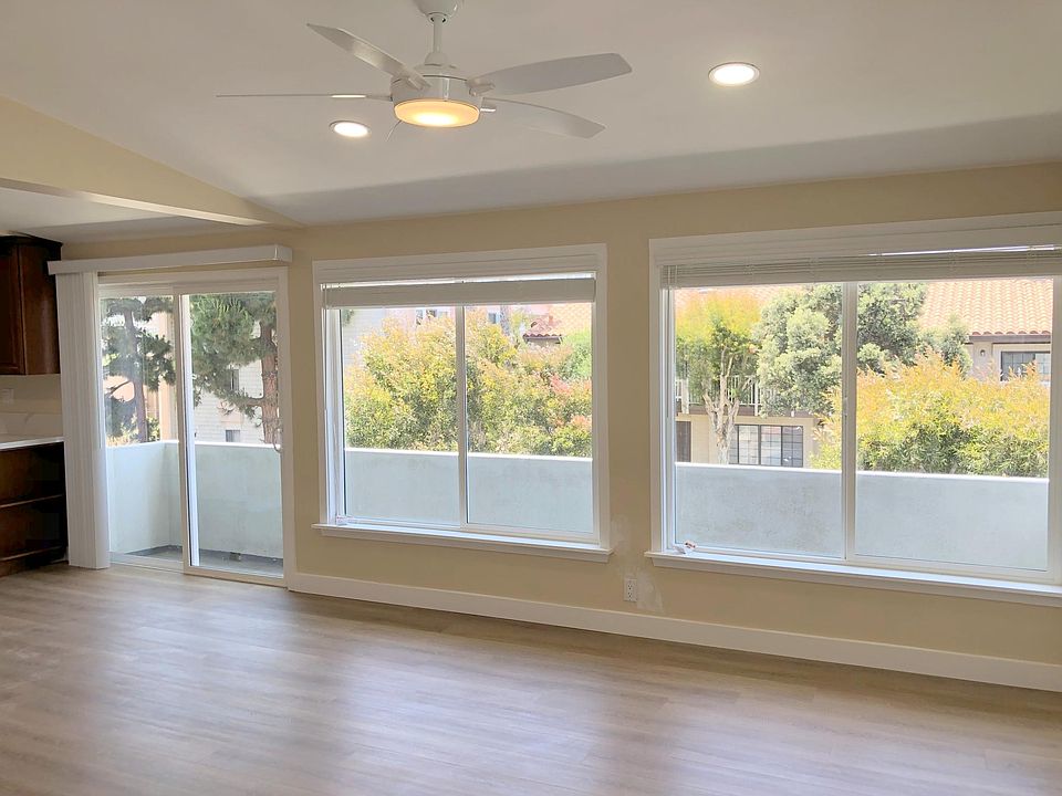 Living Room Double Pane Windows and Attached Balcony
