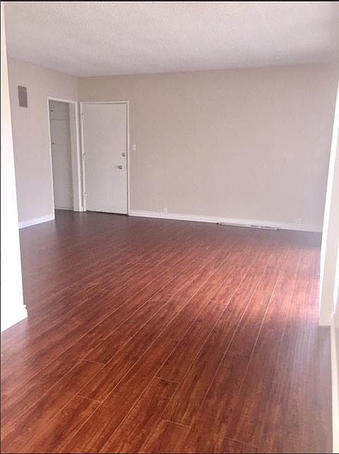 SPACIOUS LIVING ROOM WITH AMPLE NATURAL LIGHT