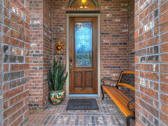 Nice welcoming from porch with beautiful front door.