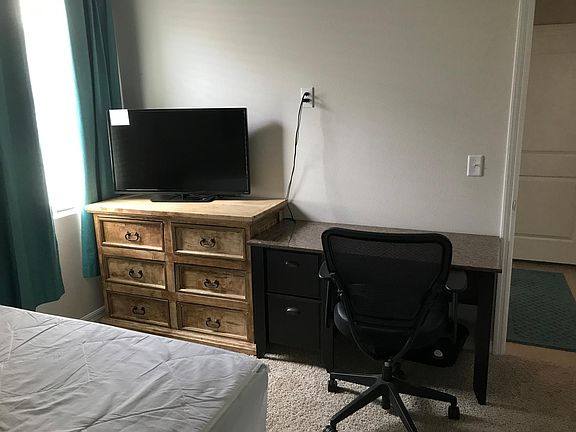 Your bedroom with dresser, TV and desk!