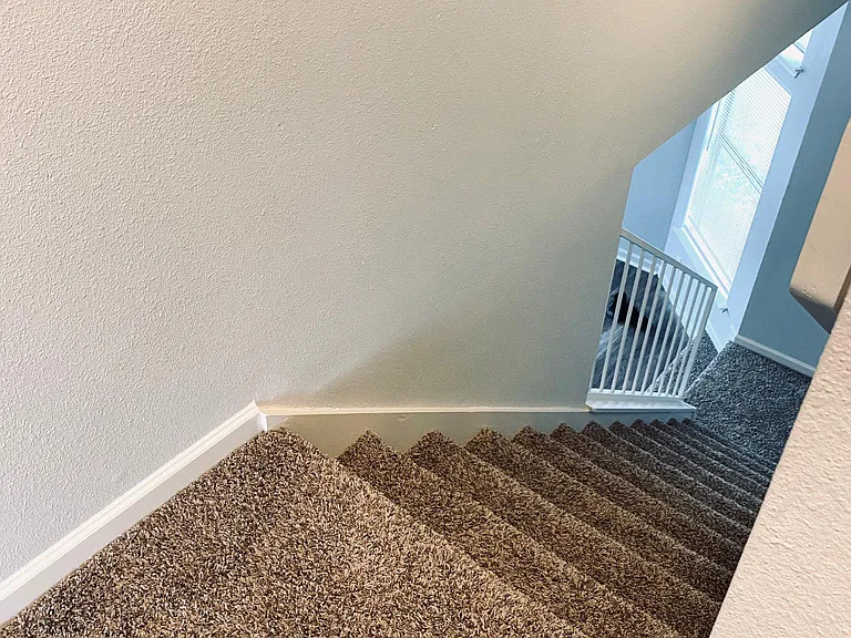 Stairwell. All carpet is new. Carpet is only on the stairs, landing and two upstairs bedrooms.