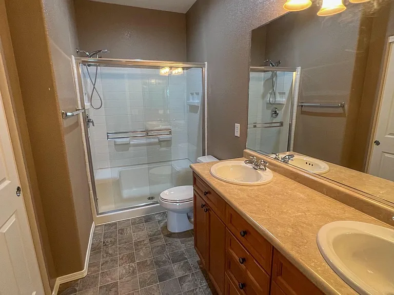 Bedroom1 private full bath. Large towel closet on left.