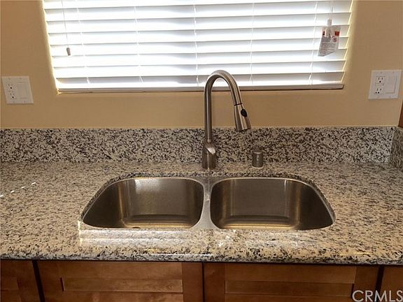 Granite counter tops and stainless steel sink and appliances