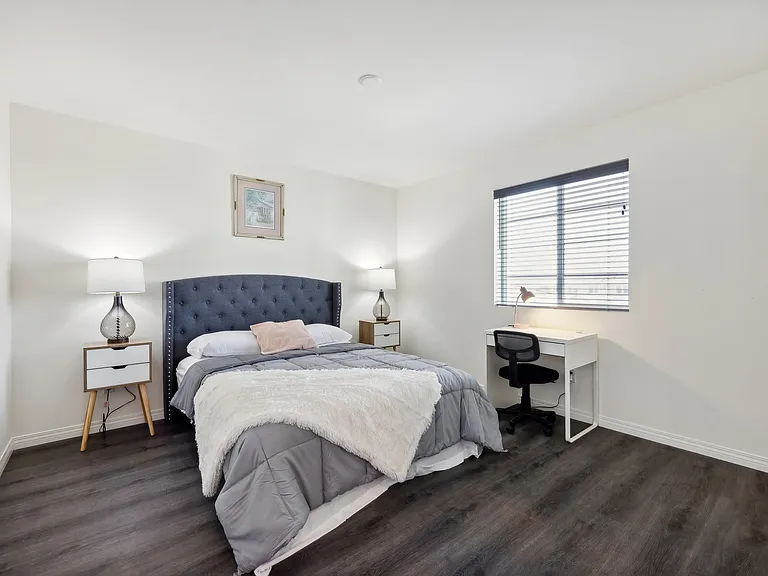 Work and unwind! This bedroom features a cozy workspace, perfect for productivity and relaxation