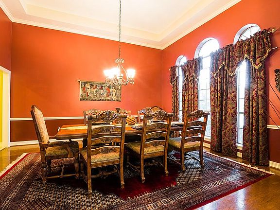 The dining room is fit for a king. There is room for 8 at this table plus room for additional pieces
