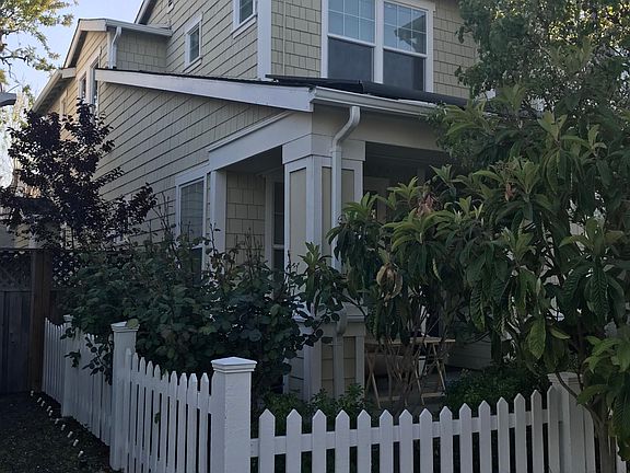 Front yard with white picket fence.