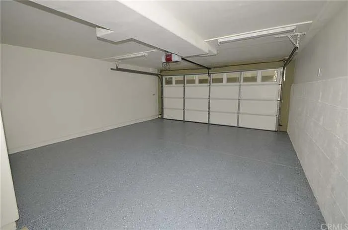 3 car tandem garage, equipped with MyQ access and security