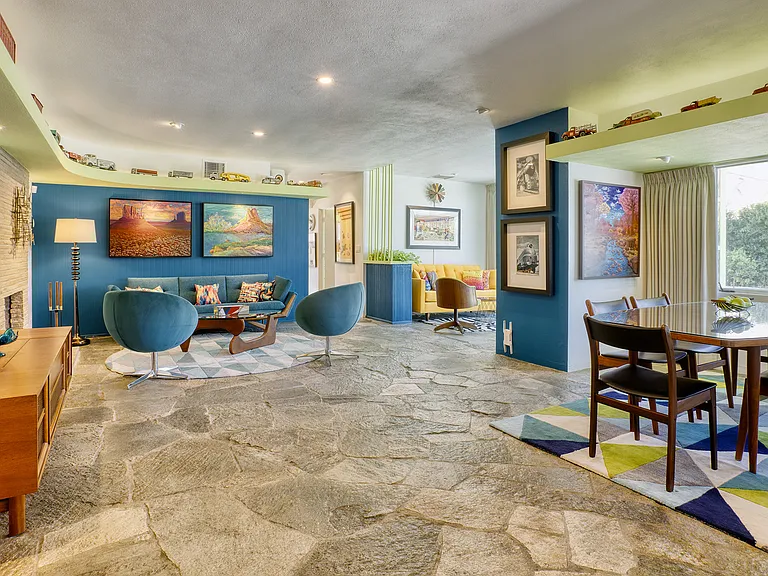 The great room with ruggedly beautiful and original flagstone floors.