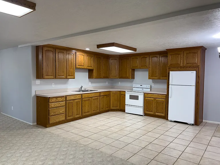 Basement features a full kitchen