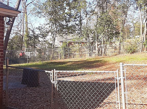 Gated backyard on both sides