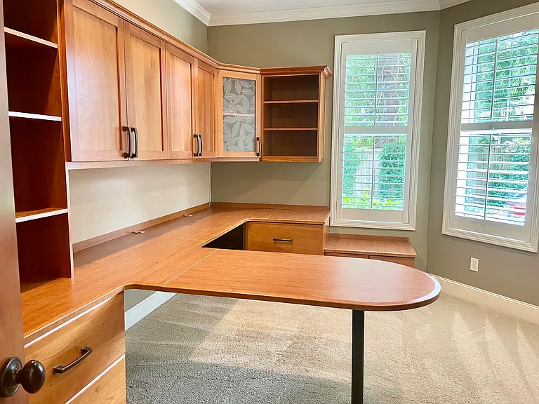 Office with custom wood cabinetry