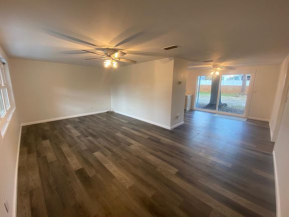 Living room with open floorplan to dining area