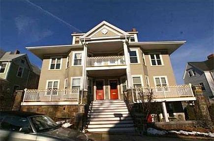 Street view of 5 unit complex with unit off to left and glimpse of shared front deck (compared with private back deck and shared roof deck)