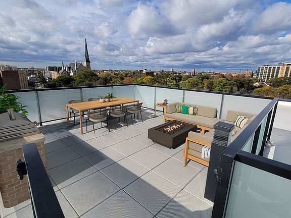 Private paver rooftop terrace - virtually staged