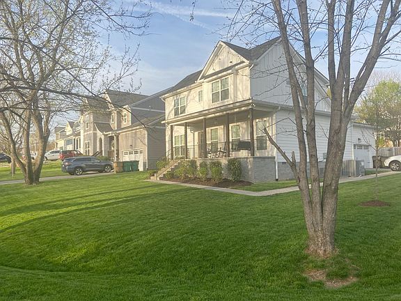 Corner lot. Pictured: garage and front porch.