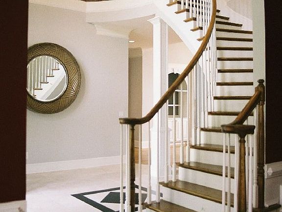 Entry foyer with curved staircase!