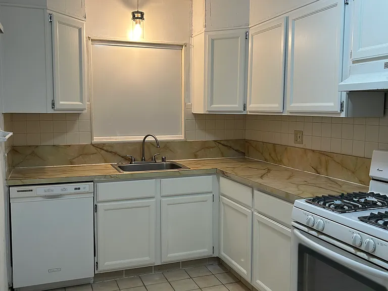 Kitchen with lots of cabinets and storage - new gas stove and pantry