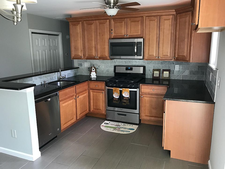 Tile floor, marble backsplash, granite counters, and high qu