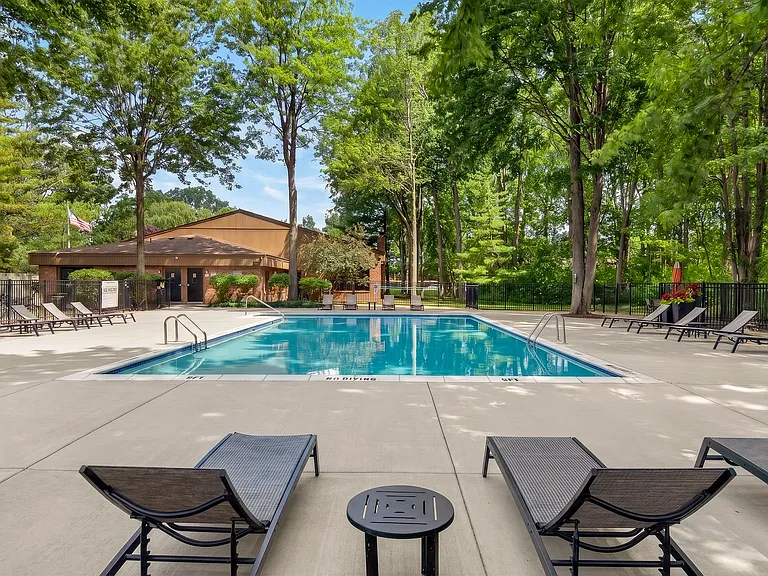 Heated swimming pool with sundeck at Eastwood Village Apartments in Clinton Township, MI.