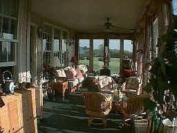 Sunroom overlooking pool and Seneca Lake