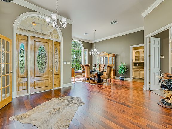 The home's open living spaces are immediatly experienced upon entering the front doors.