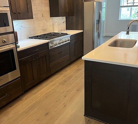 Large kitchen with gas cooktop., refrig, wall ovens and dishwasher.