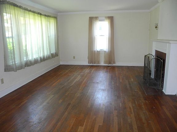 Living Room with hardwood floors and plenty of windows