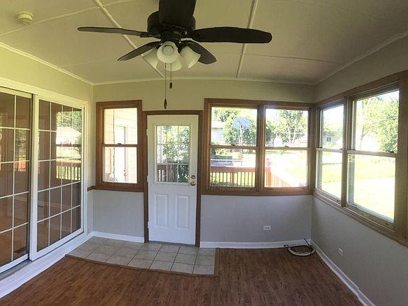 Inside 4 season room, sliding French door to kitchen on left