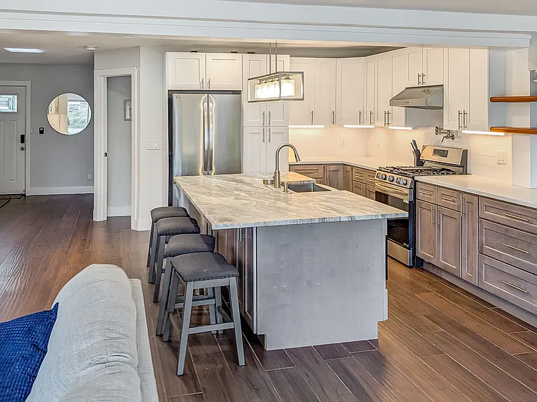 Full open concept entertaining kitchen with views out over the water
