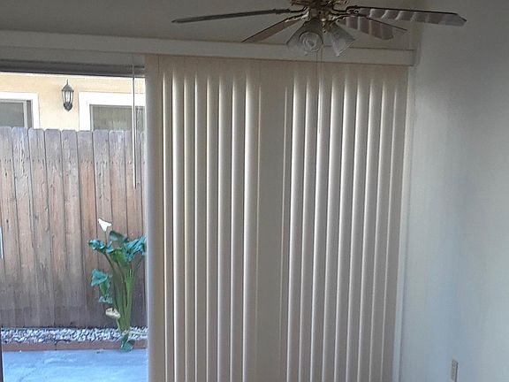 Patio door leads from dining room/kitchen to private enclosed patio area.