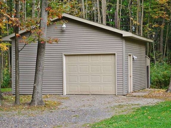 Large Pole Barn, with an area for storing wood!