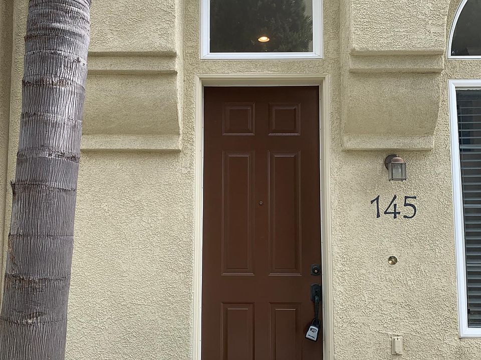 Entry to your new home. Small patio area to left of entry door.