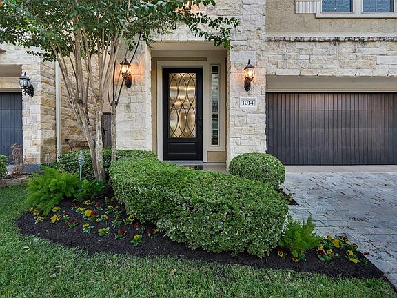The Iron Door features an attractive pattern of Privacy Glass. And the Side Window allows Natural Light and is even complete with an attractive Wood Shutter for Added Privacy. Meticulous Landscaping adds the finishing outdoor touch to this Charming a