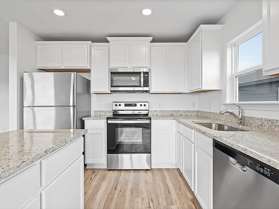 Lots of storage and counter space are found throughout the kitchen