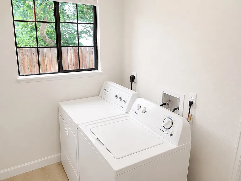 In unit laundry room - NEW dryer, flooring and paint