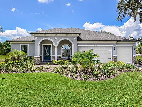 Joyce home french country with optional stone elevation front exterior view by William Ryan Homes Ta
