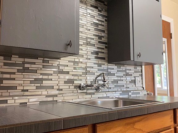 Tile and deep stainless steel sink