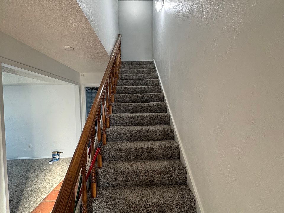 Upstairs to 2 bedrooms and second bathroom.