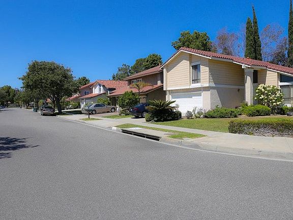 Large wide streets in tree lined neighborhood.