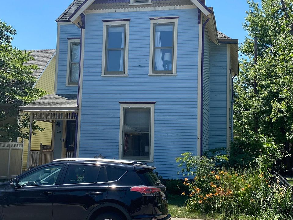 Exterior front with tenant's car on street.
